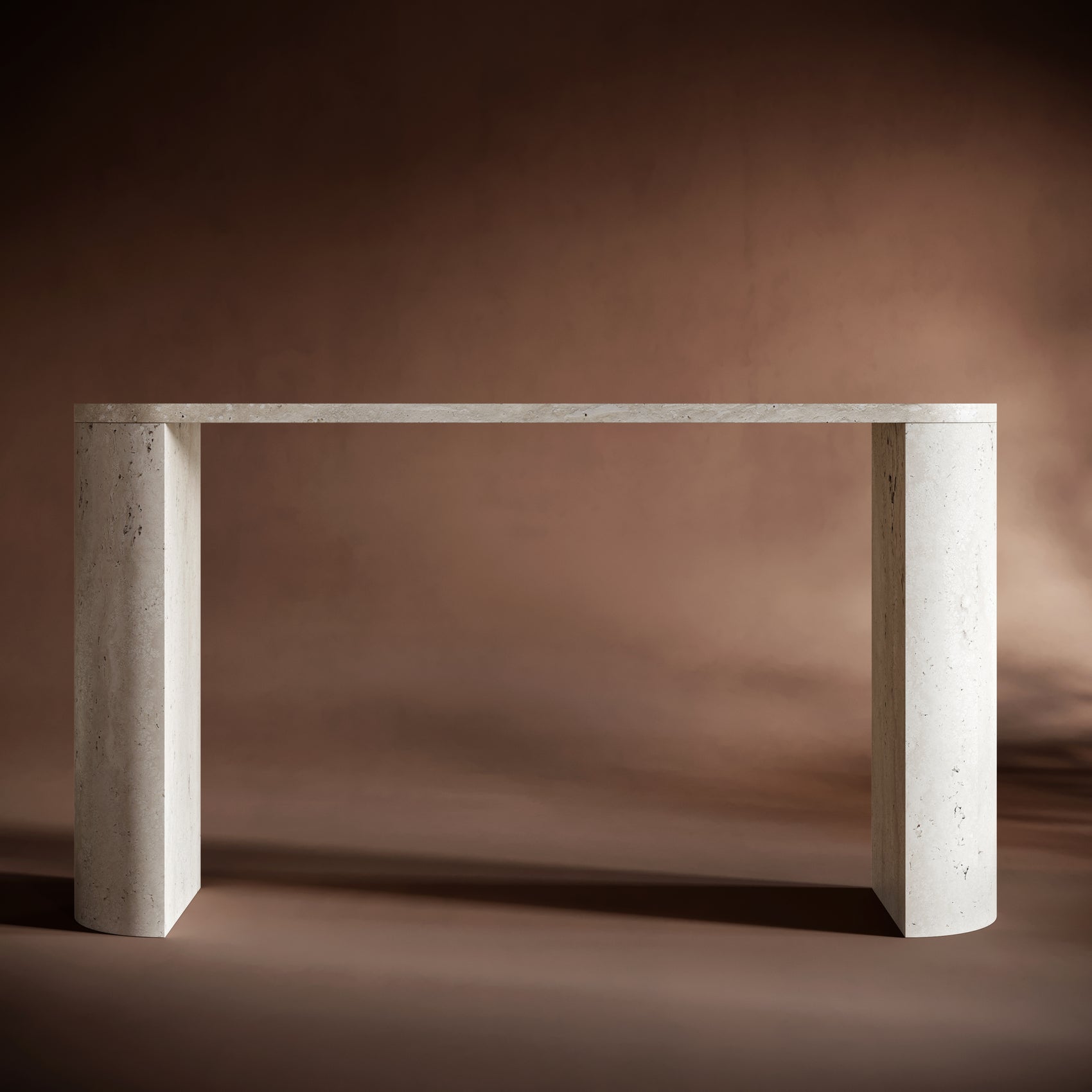 Handcrafted travertine console table with oval-shaped top and sculptural design.