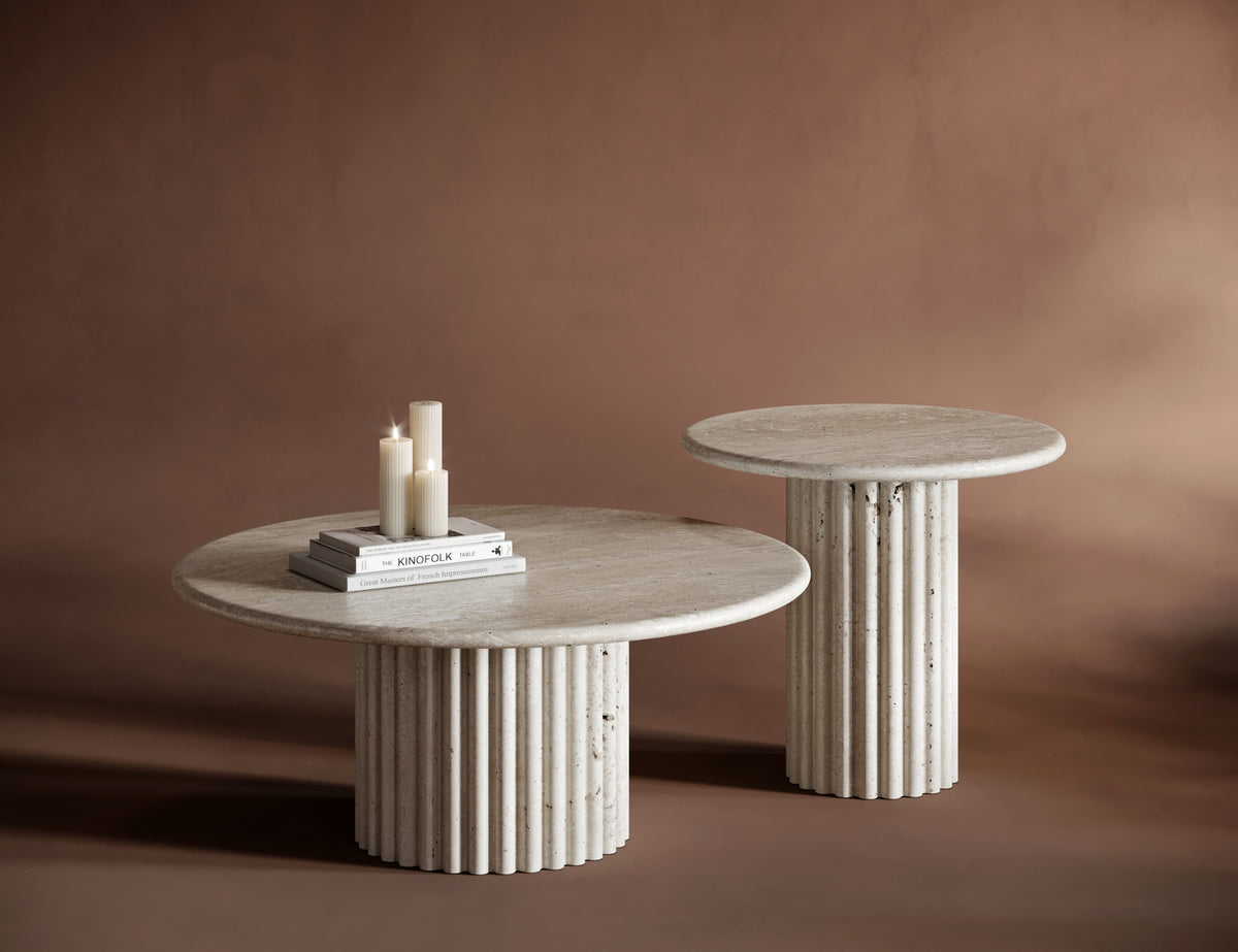 Close-up of the BIANCA travertine coffee table’s fluted base and natural stone veining.