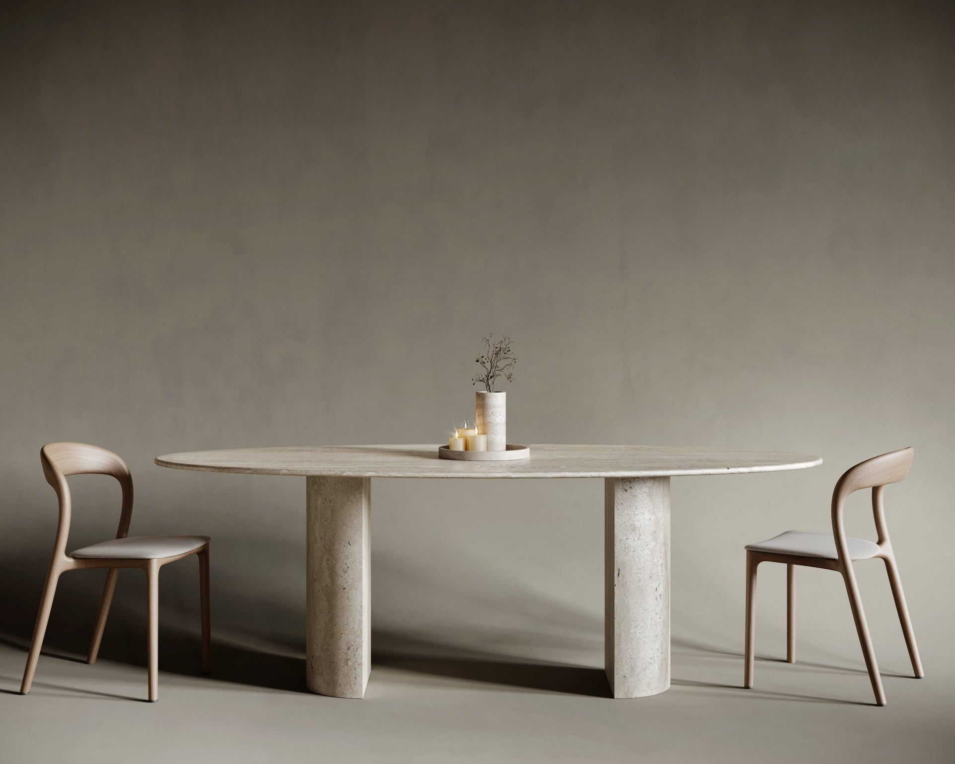 Contemporary ellipse travertine dining table with a sculptural semi-cylindrical base, highlighting soft curvature and asymmetrical balance; crafted from honed travertine with rich texture, perfect for design-led interior spaces.