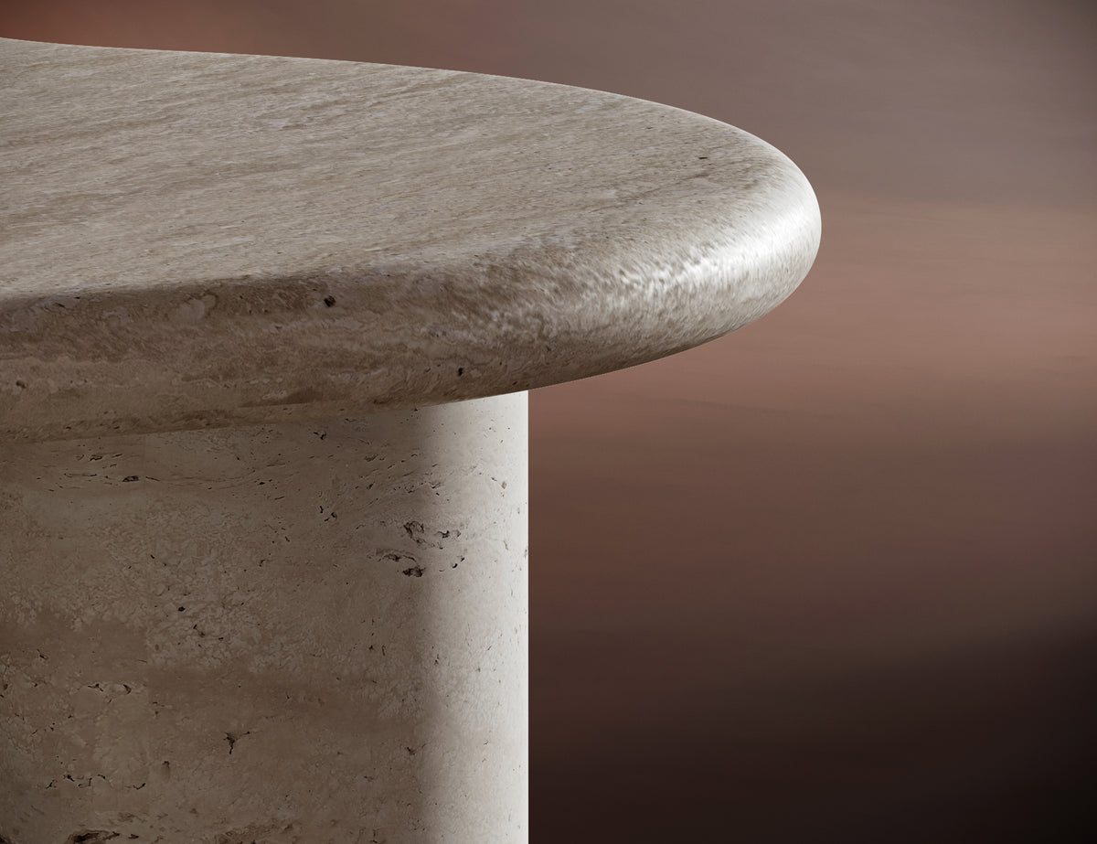 ISABELLA coffee table set against a warm brown background, emphasizing its natural textures and artistic form.