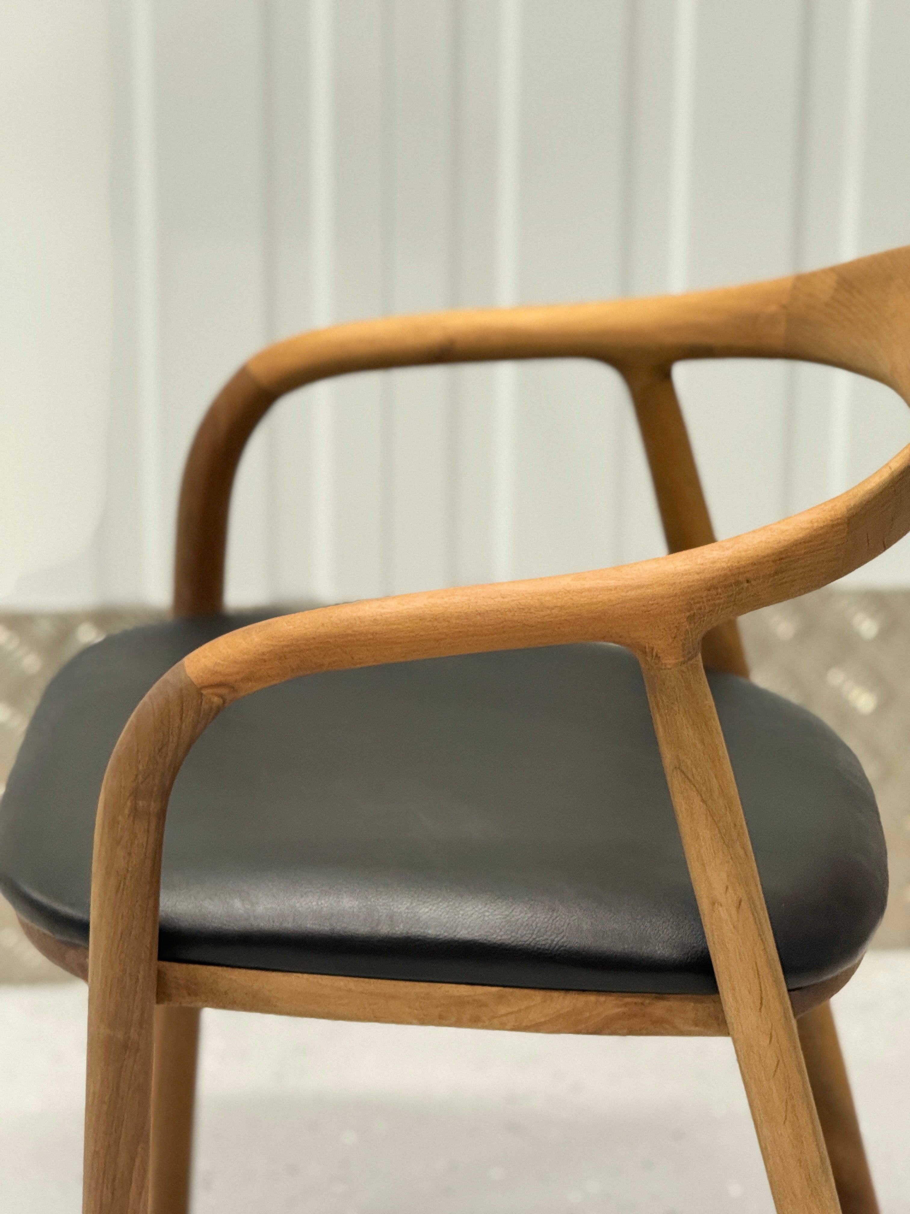 Elegant N-Chair in beechwood, featuring a durable solid wood structure and a sleek, minimalist profile.