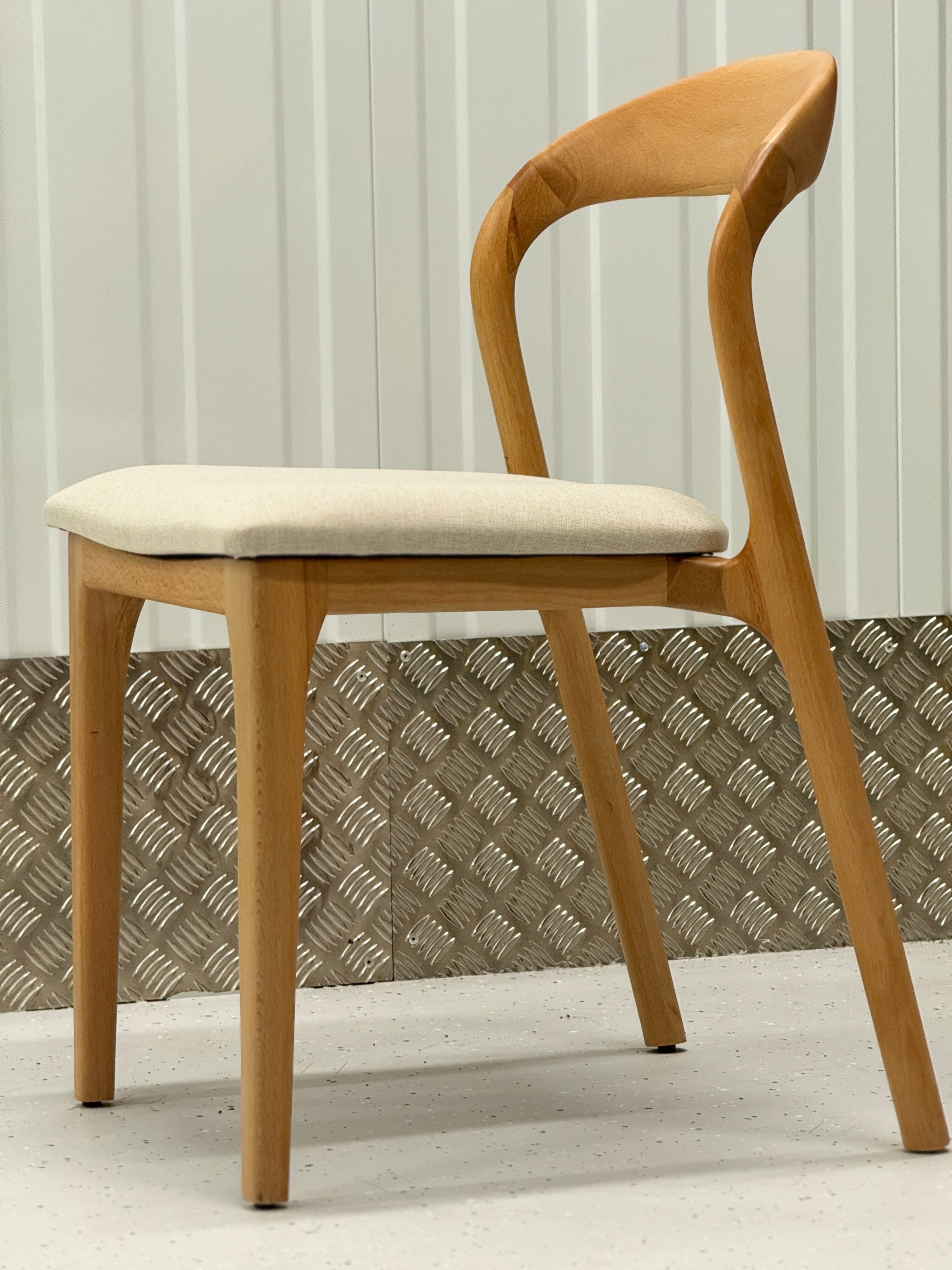 Durable wooden chair with a clean, minimalist design and natural wood finish, suitable for any dining or living space