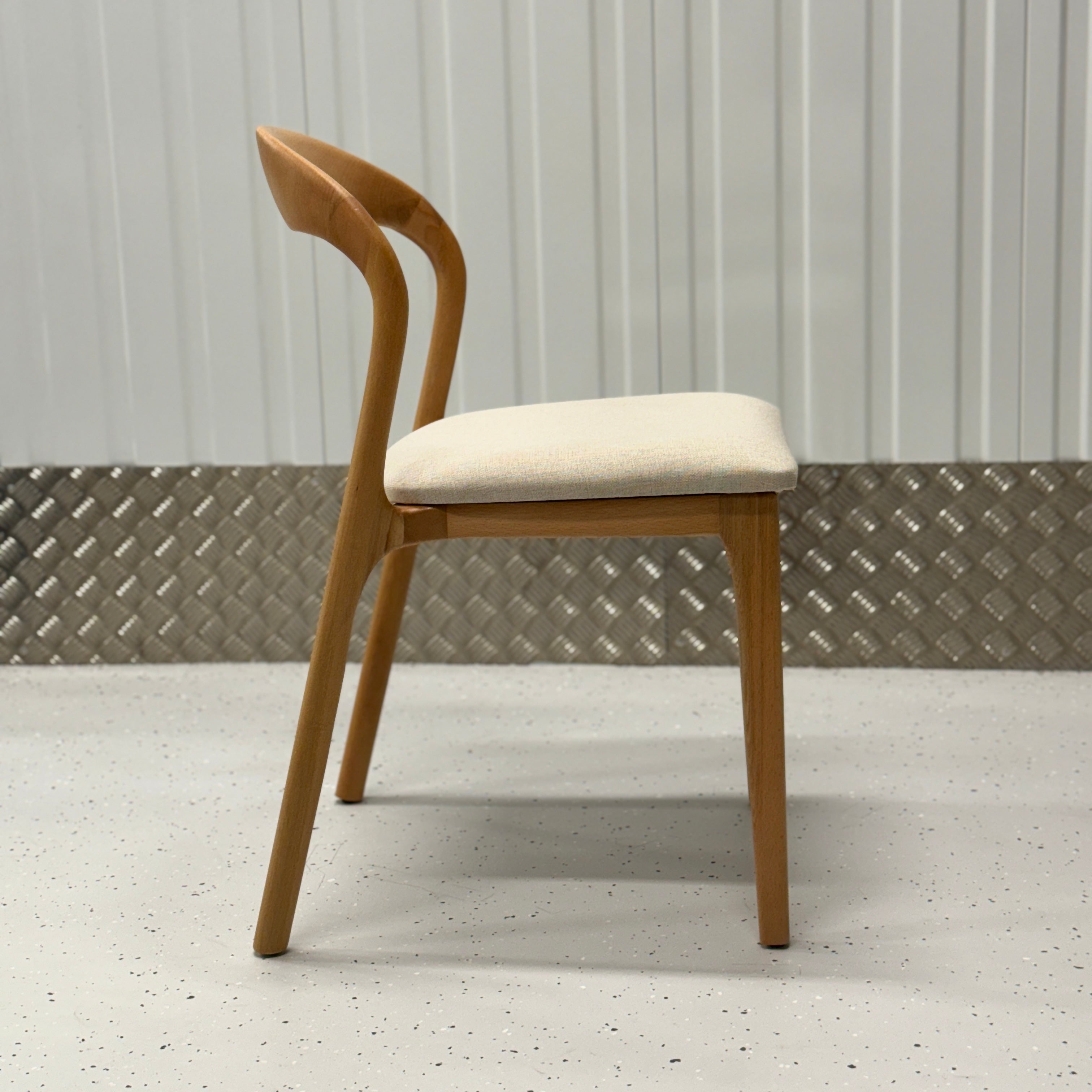 Iconic N-Light Chair with gentle curves and a timeless design, ideal for modern dining furniture setups