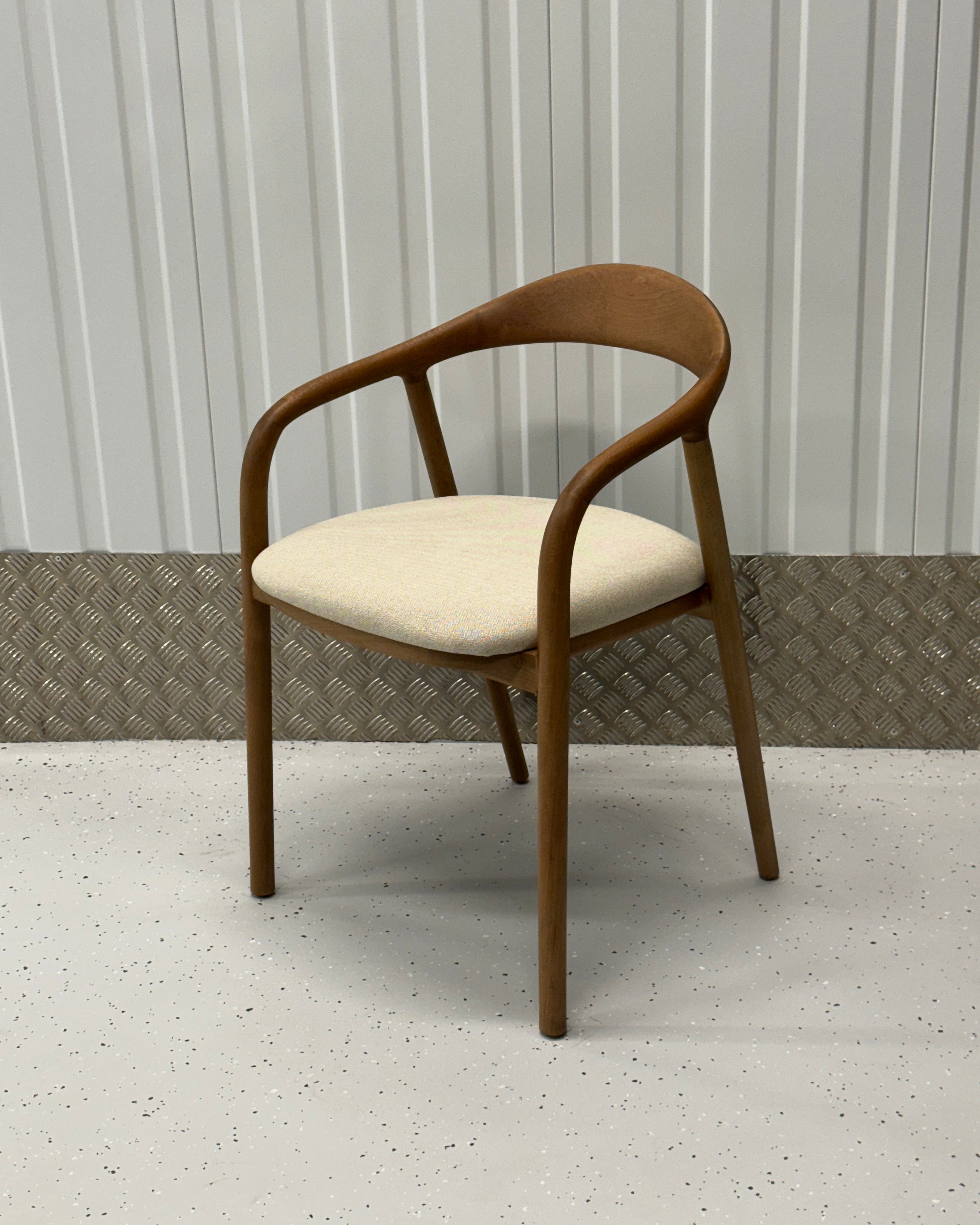 N-Chair in beechwood finish, featuring a light, Scandinavian-inspired design with a curved backrest and solid wood frame.