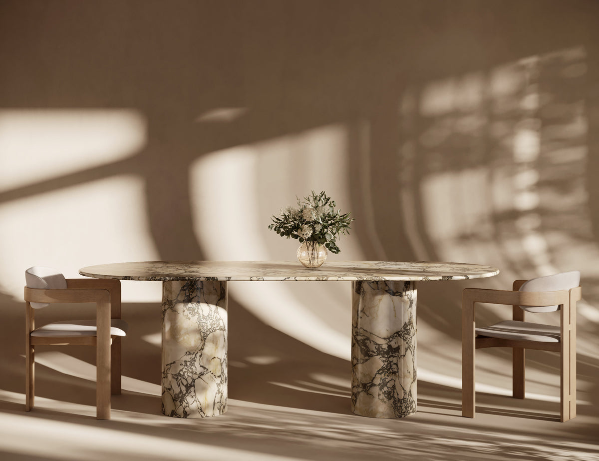 Oval Calacatta Viola marble dining table with cylindrical legs, featuring elegant veining, luxury Italian craftsmanship, smooth marble finish, timeless oval marble dining style