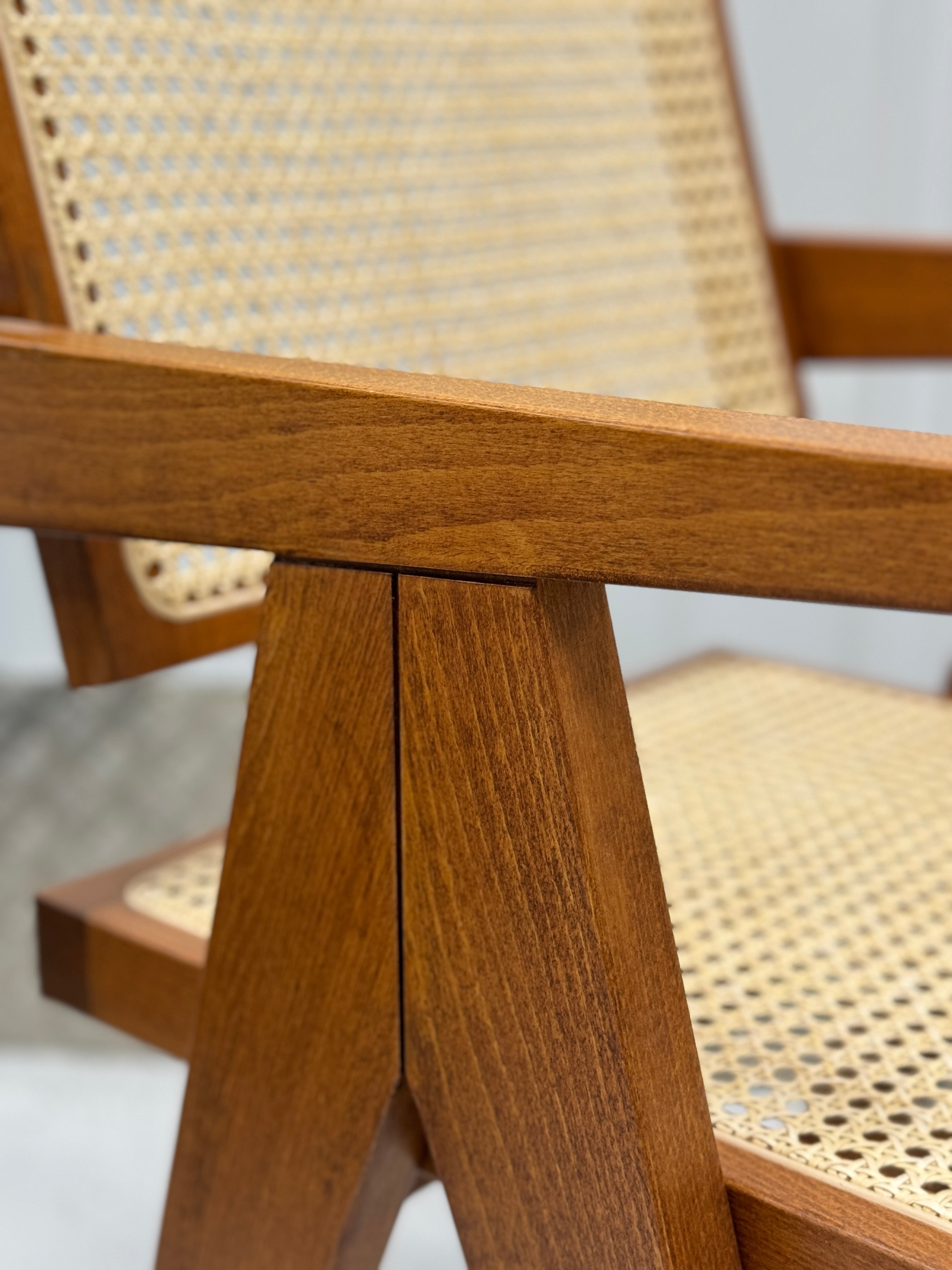 Handmade Pierre Dining Chair combining organic rattan details with a sleek, durable wooden frame for versatile home decor.