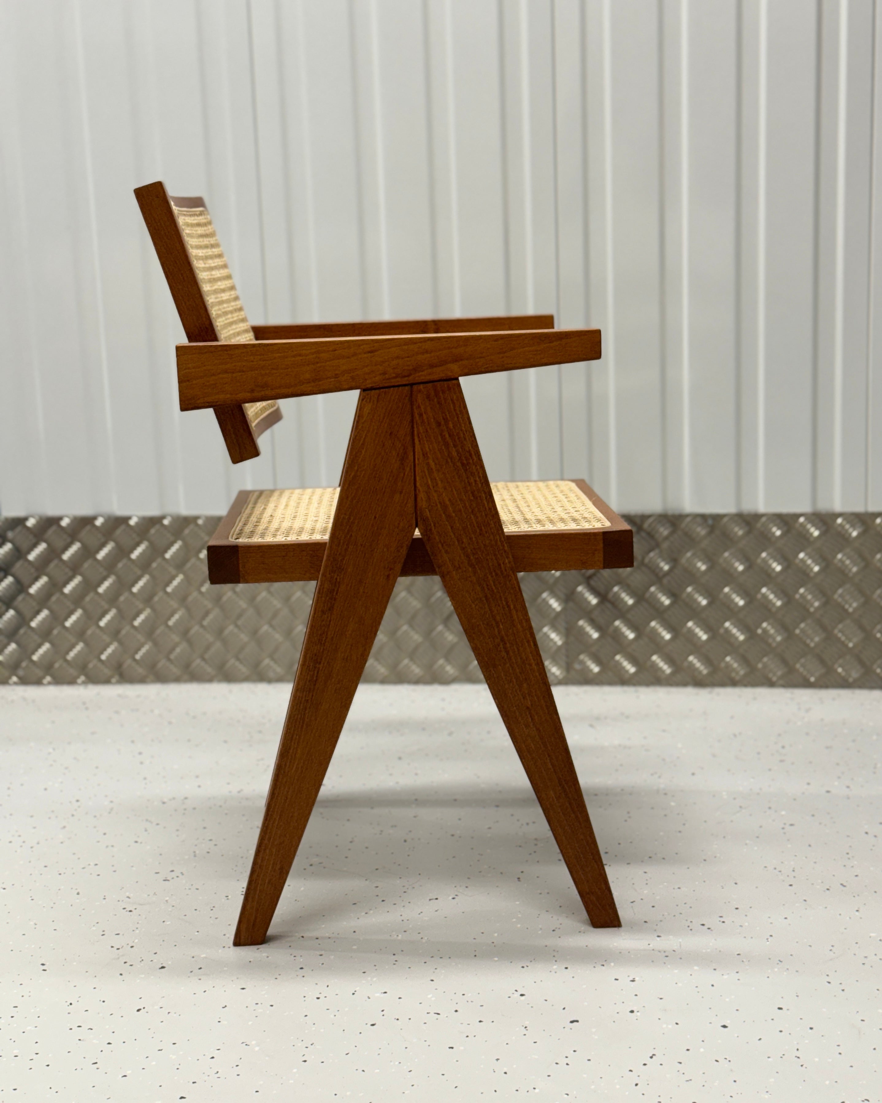 Modern dining chair with a Pierre Jeanneret-inspired design, blending natural materials like rattan and wood for a sophisticated look.