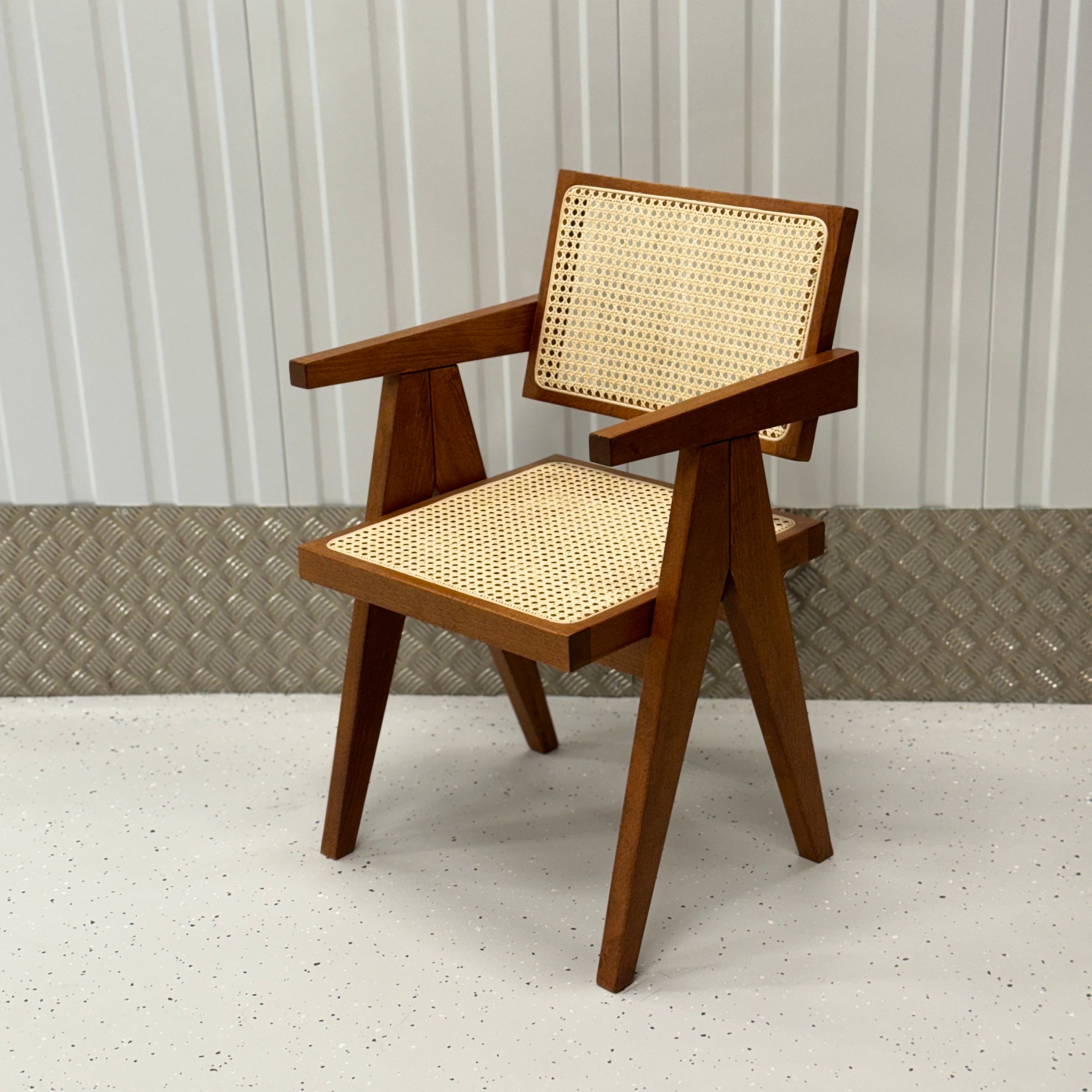 Pierre Dining Chair by BEDÚ Atelier featuring a solid wood frame and rattan caning, inspired by Pierre Jeanneret’s iconic design.