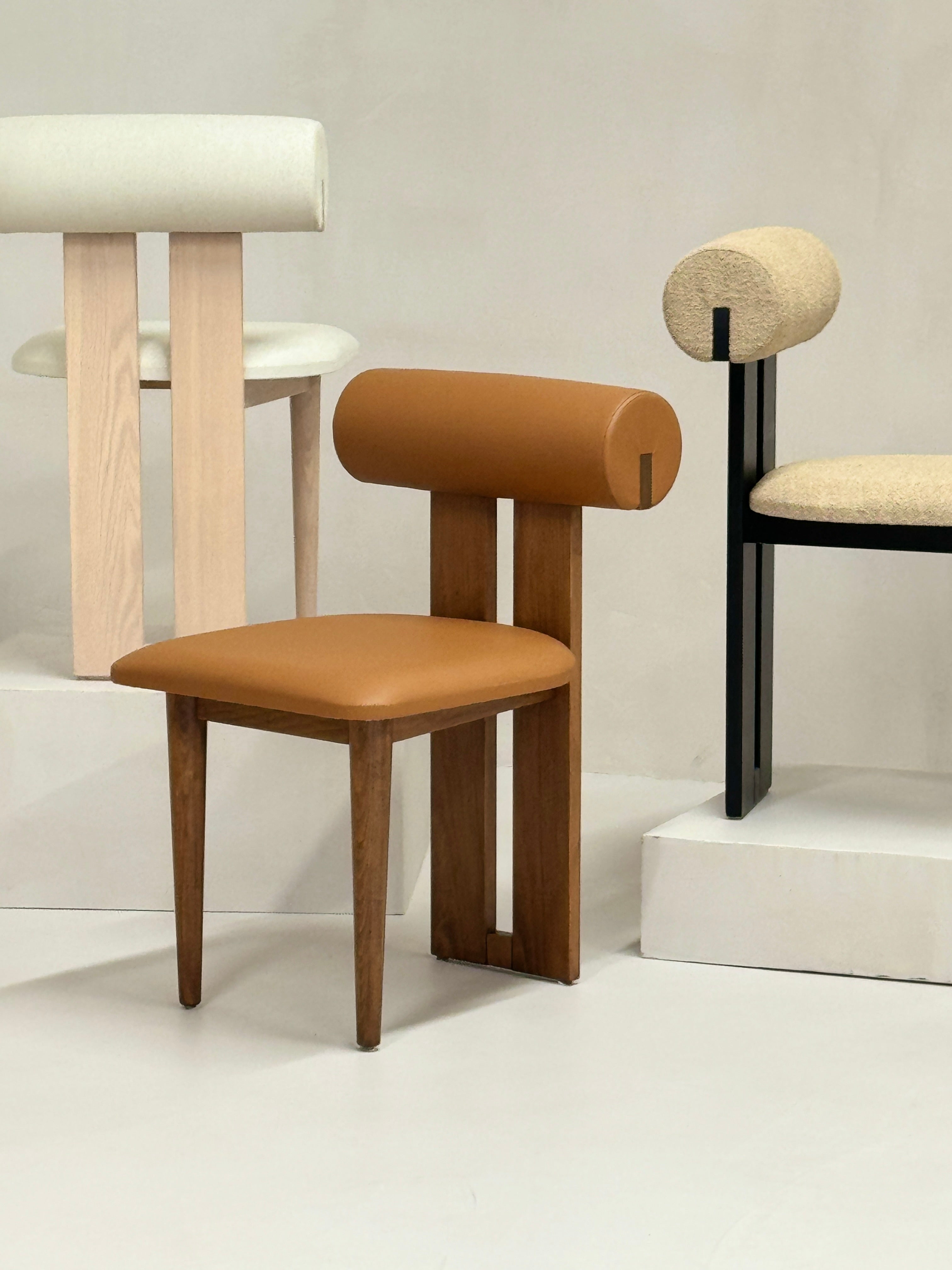 "Elegant Roll Chair crafted with a wooden frame and unique cylindrical backrest, ideal for travertine or marble dining tables."