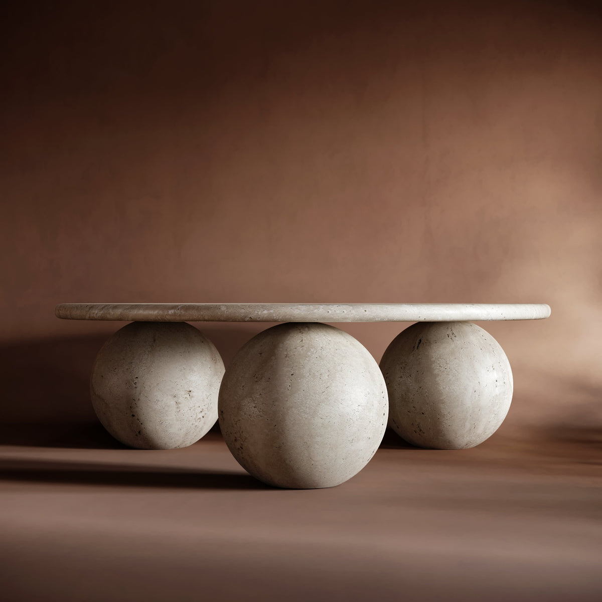 Round travertine coffee table with three ball base, sculptural modern design, stone center table look, 3 ball travertin style, natural finish for elegant interiors.