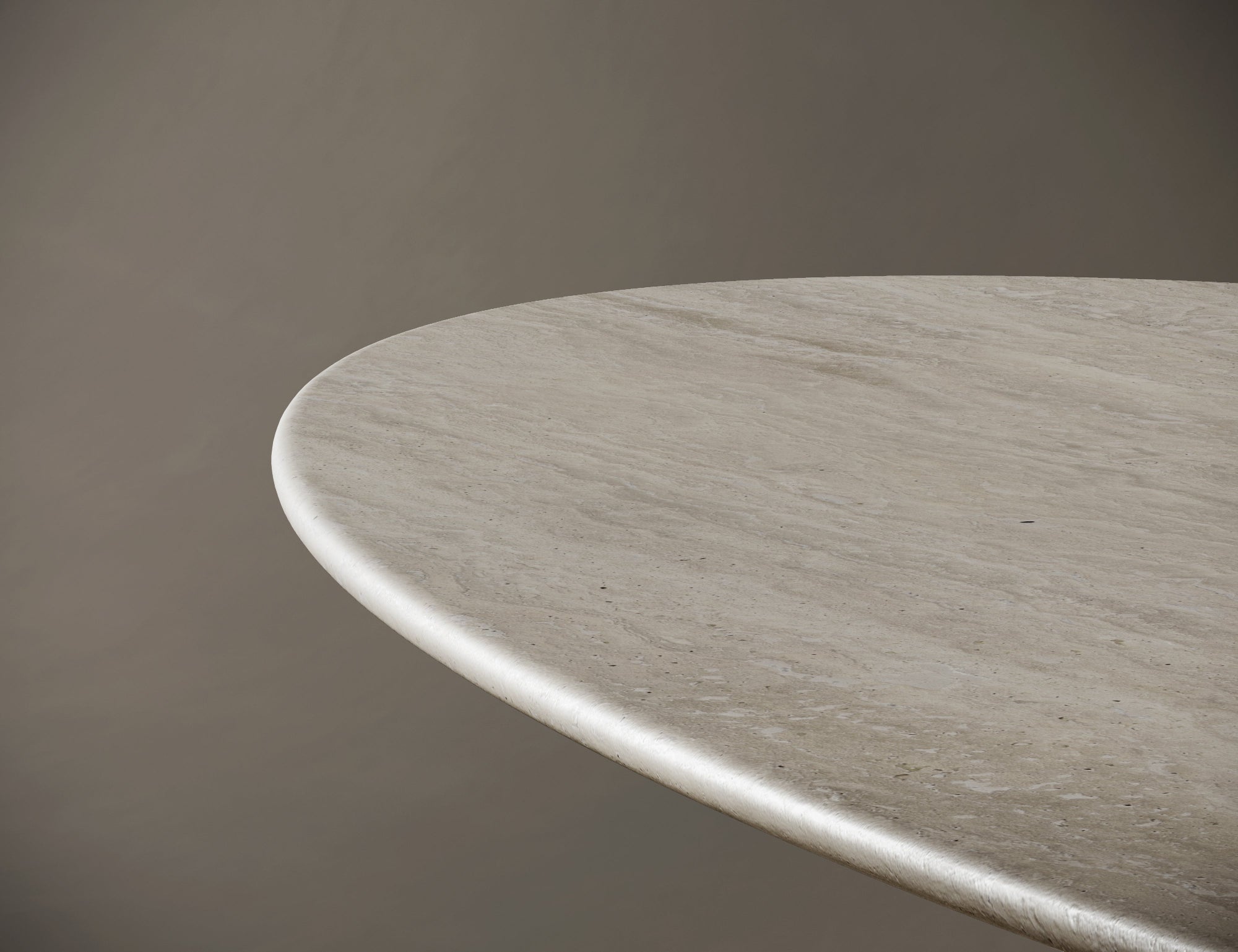 Interior scene featuring ellipse travertin table with gently rounded base.