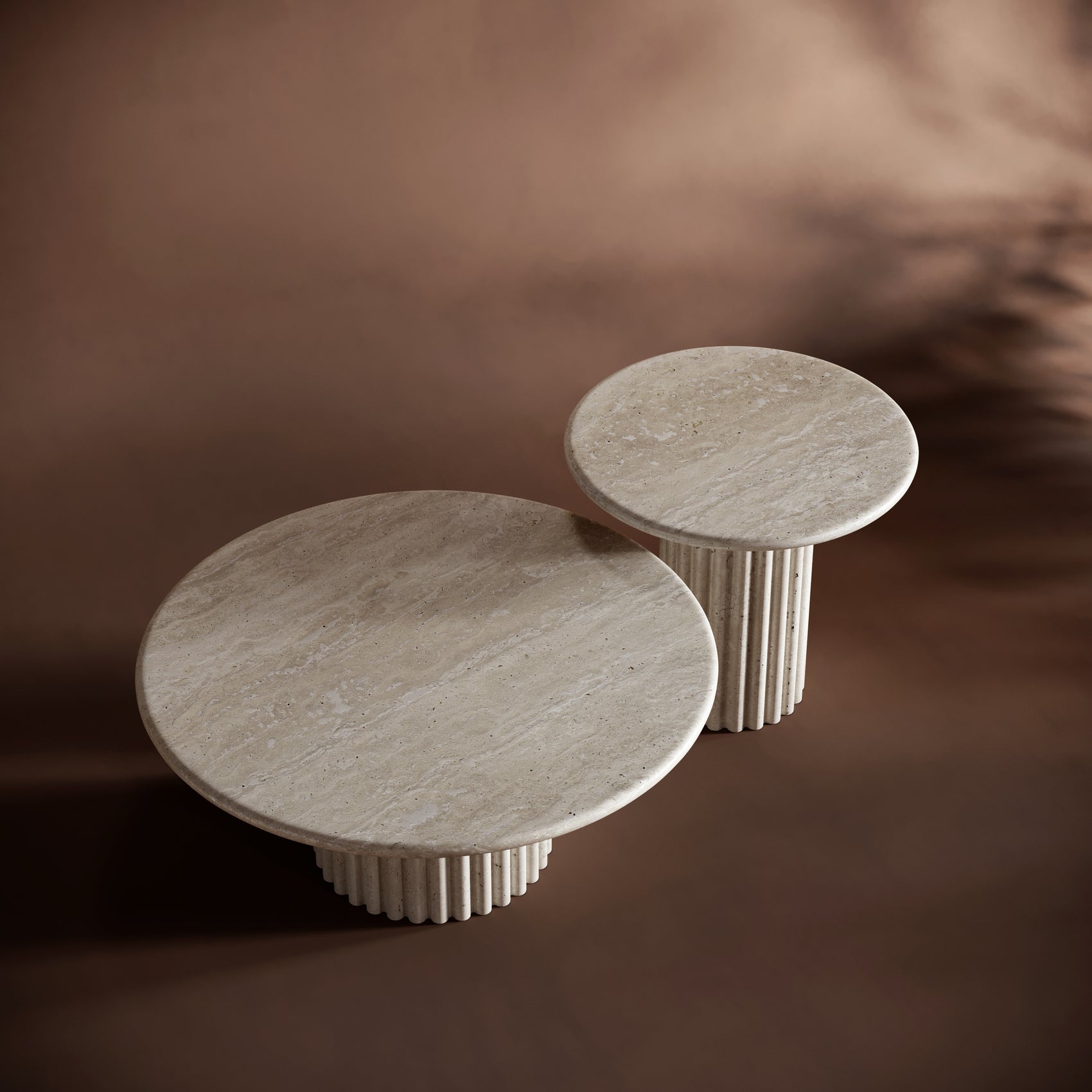 Modern living room featuring the BIANCA travertine coffee table set in a minimalist setting.

