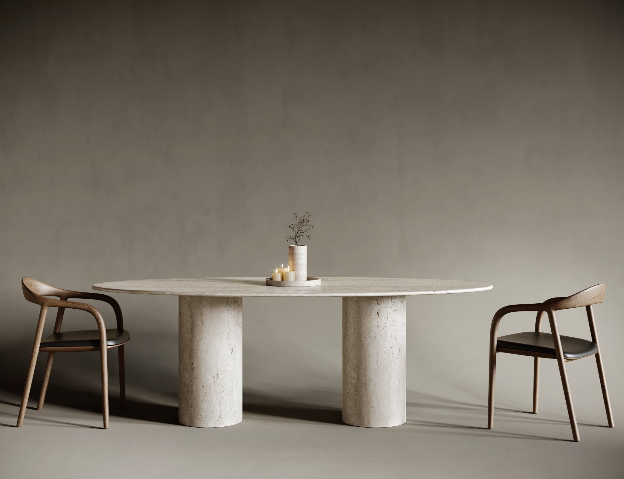 Ellipse travertine table with single cylindrical leg, soft oval top on solid round base.

