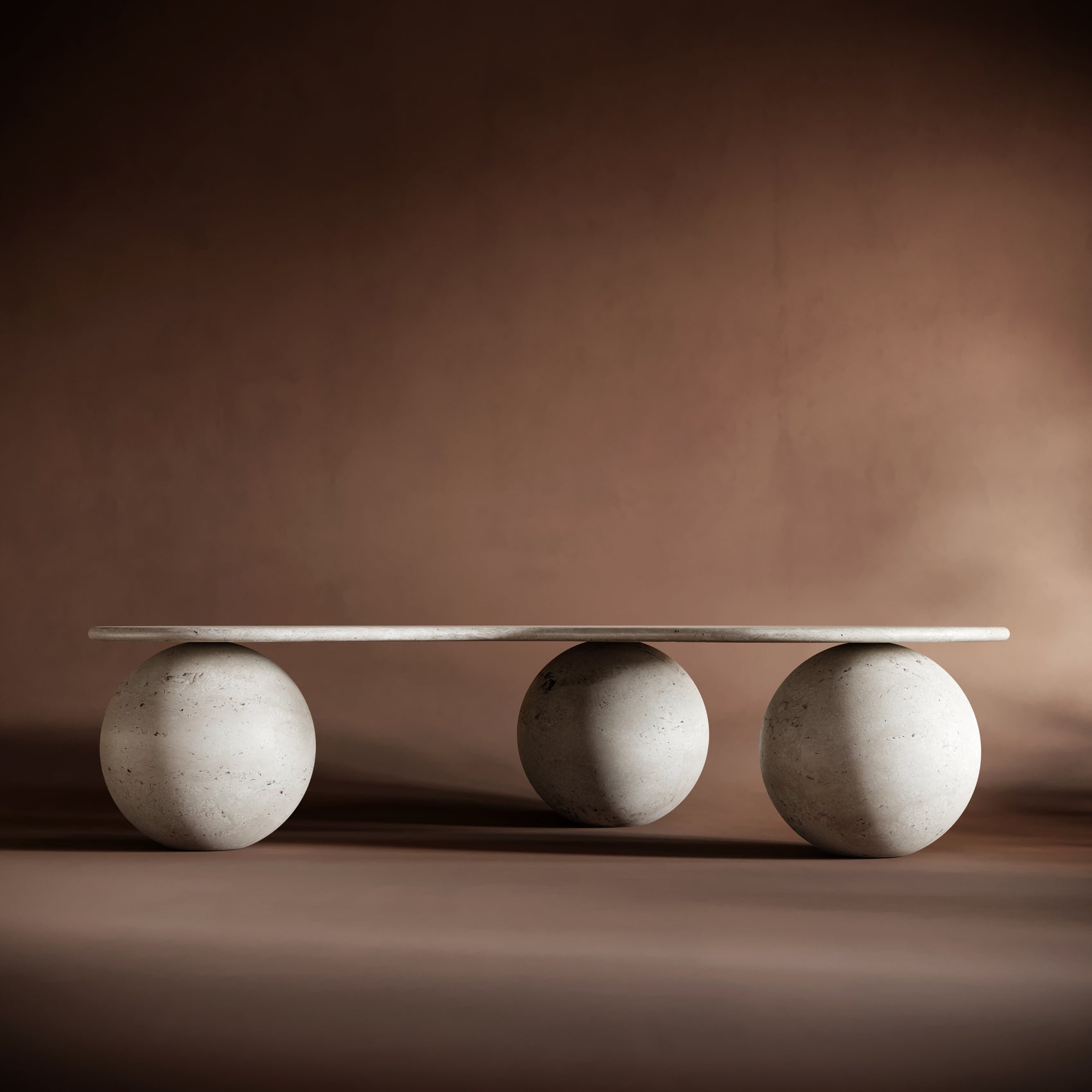 Elegant FABIO travertine coffee table set in a Mediterranean-inspired living room, emphasizing its organic design.
