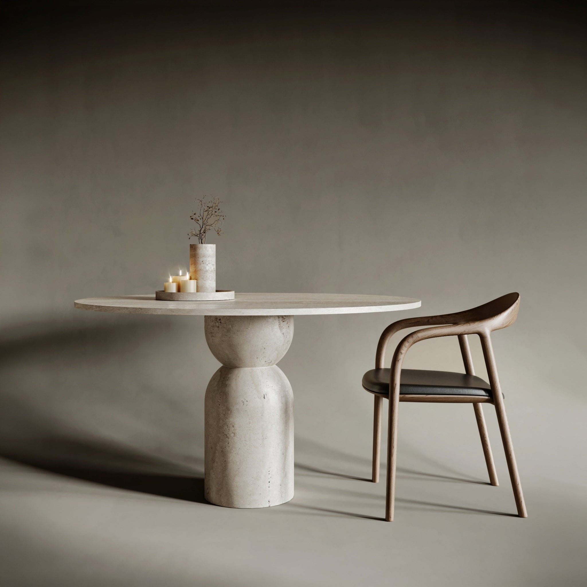 Statement round travertine dining table with an hourglass-shaped base, embodying fluid geometry and balanced tension; crafted from richly textured stone, this piece merges sculptural form with functional design