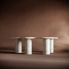 Modern living room featuring the ISABELLA travertine coffee table can be styled with books and decor.
