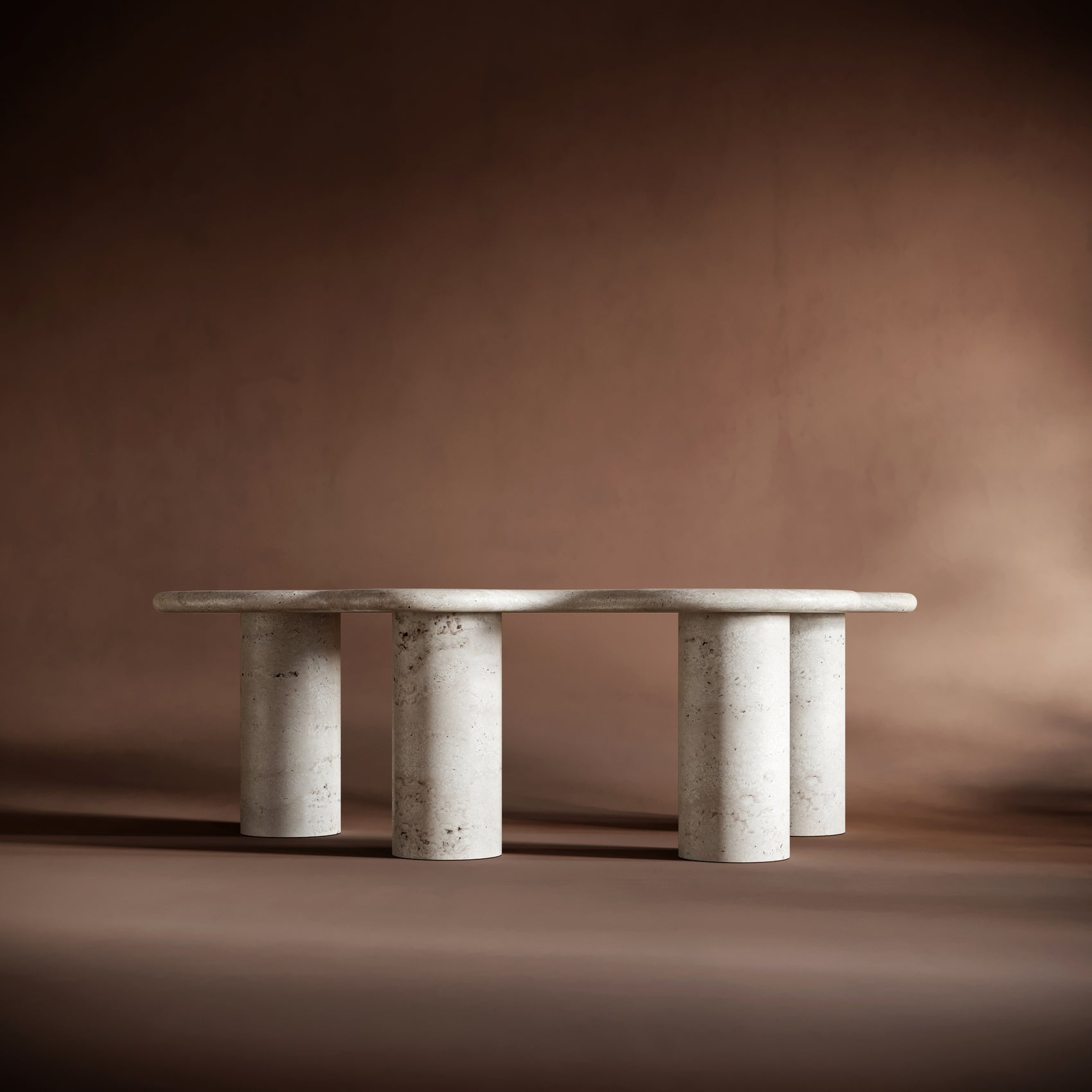 Modern living room featuring the ISABELLA travertine coffee table can be styled with books and decor.
