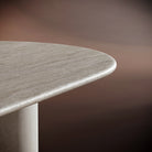 Close-up of MATTEO coffee table’s natural veining and cylindrical base design, highlighting its premium craftsmanship.
