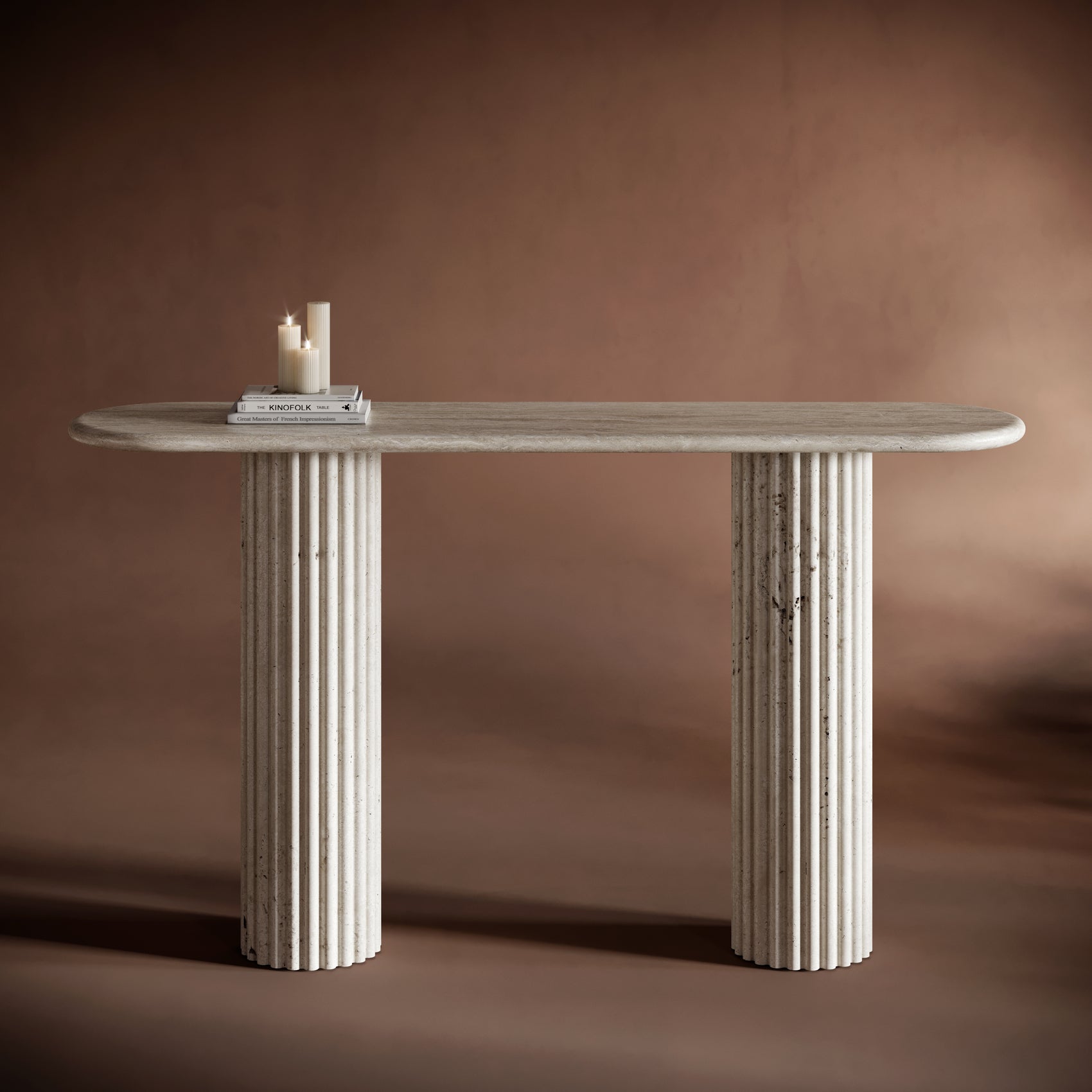 Travertine console table with fluted columns against a dark background.