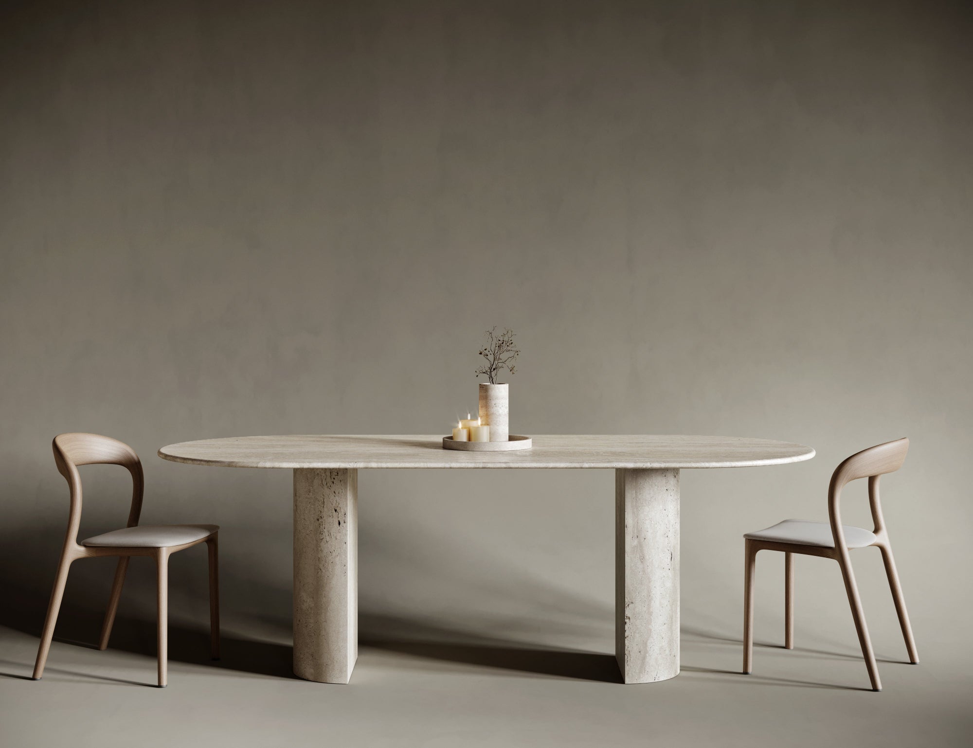Oval travertine dining table with a bold semi-cylindrical leg, marrying traditional stone craftsmanship with modern sculptural aesthetics; smooth honed surface and soft stone hues create a harmonious centerpiece for refined interiors.