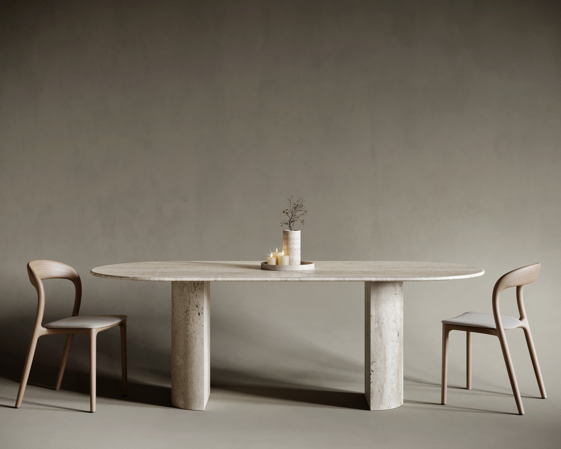 Oval travertine dining table with a bold semi-cylindrical leg, marrying traditional stone craftsmanship with modern sculptural aesthetics; smooth honed surface and soft stone hues create a harmonious centerpiece for refined interiors.