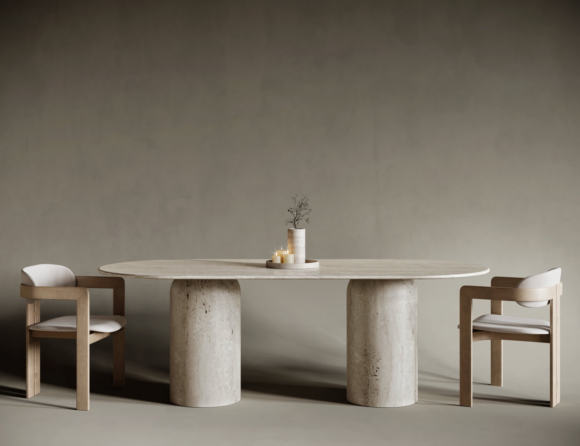 Oval travertine table with unique rounded base, organic leg shape paired with soft stone top.

