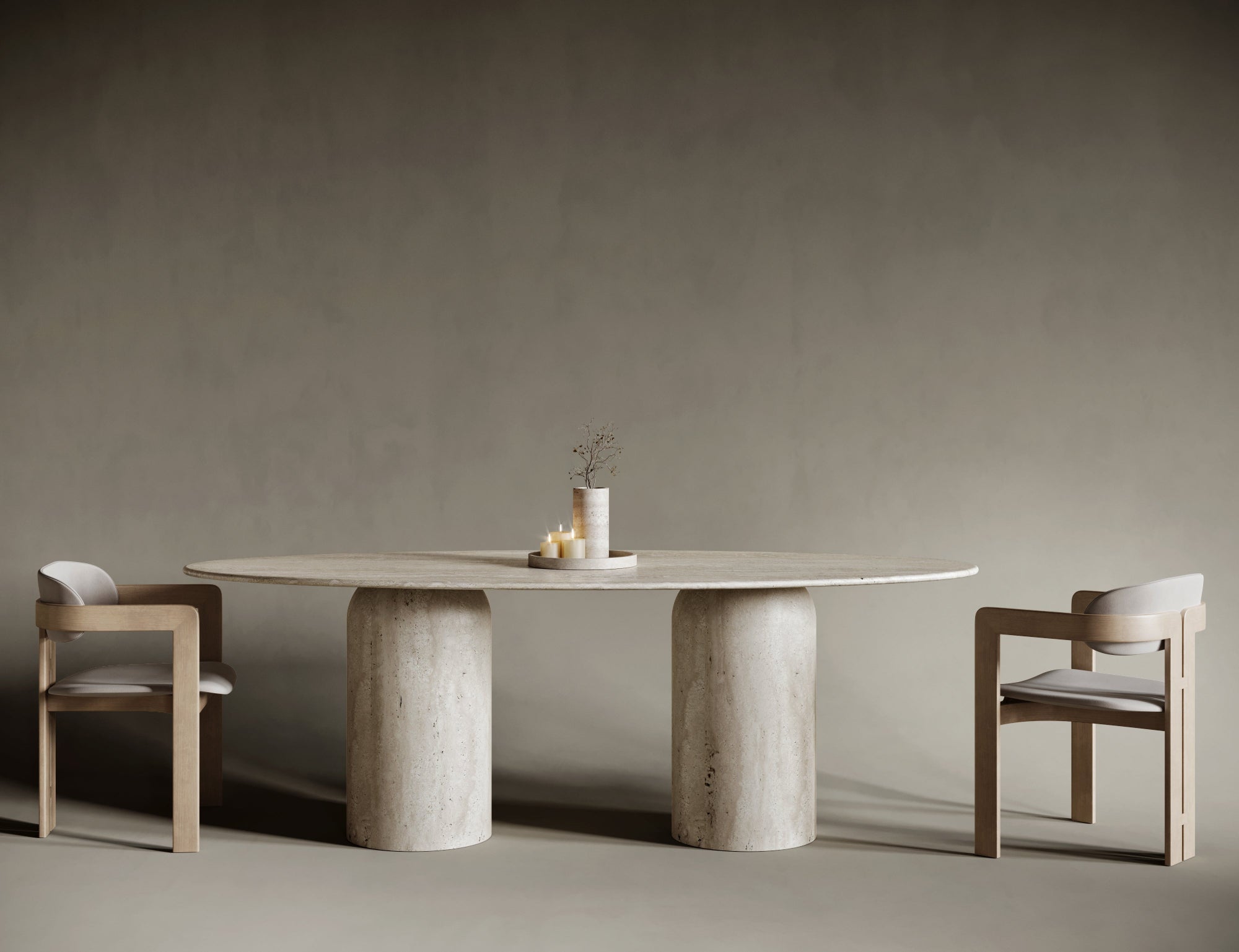 Ellipse travertine dining table with rounded leg, organic base under oval stone top.

