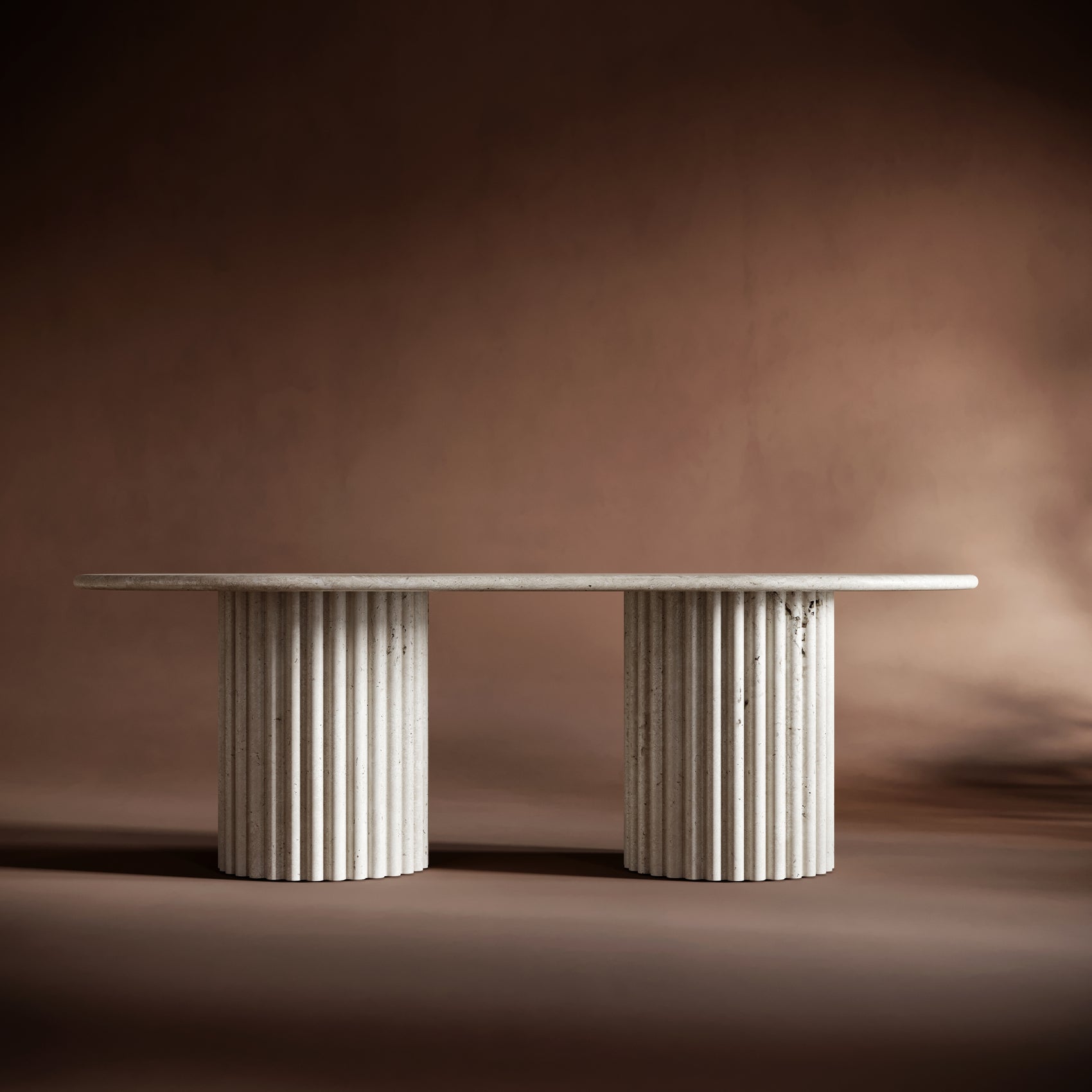 Elegant SERENA travertine coffee table set against a warm reddish-brown background, emphasizing its timeless design.
