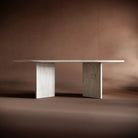 Modern travertine coffee table against a brown background